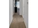 Hallway with carpet flooring that provides an open view into the design of the home at 4323 Stubbington Ln, Indianapolis, IN 46239