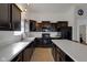 Bright kitchen featuring black appliances, dark cabinetry, and a spacious layout at 4323 Stubbington Ln, Indianapolis, IN 46239