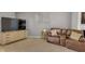 A cozy living room area featuring a comfortable leather reclining sofa and stylish accents at 4323 Stubbington Ln, Indianapolis, IN 46239