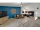 Inviting living room with dark blue accent wall and stylish decor at 4323 Stubbington Ln, Indianapolis, IN 46239