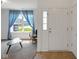 Cozy living room with natural light, a comfortable chair, and stylish decor at 4323 Stubbington Ln, Indianapolis, IN 46239