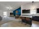 Open floor plan with kitchen island seating and comfortable living area at 4323 Stubbington Ln, Indianapolis, IN 46239