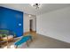 Open-concept living area featuring a bold blue accent wall and cozy seating at 4323 Stubbington Ln, Indianapolis, IN 46239