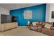 Comfortable living room with a dark blue wall and an entertainment center at 4323 Stubbington Ln, Indianapolis, IN 46239