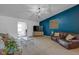 Cozy living room featuring a dark blue accent wall and comfortable seating at 4323 Stubbington Ln, Indianapolis, IN 46239