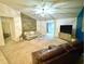 Bright living room features a vaulted ceiling, stylish light fixture and a decorative accent wall at 4323 Stubbington Ln, Indianapolis, IN 46239