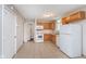 Spacious kitchen featuring modern appliances, wood cabinets, and tile flooring at 4326 Burrwood Dr, Indianapolis, IN 46235