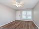 The living room features new flooring, a window, and a ceiling fan at 4326 Burrwood Dr, Indianapolis, IN 46235