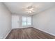 The living room features new flooring, a window, and a ceiling fan at 4326 Burrwood Dr, Indianapolis, IN 46235