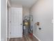 This utility area features the hot water heater with wood-look flooring at 4326 Burrwood Dr, Indianapolis, IN 46235