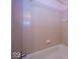 Close-up view of the bathtub with pink tiles, and shower at 4329 Dudley N Dr, Indianapolis, IN 46237