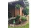 Landscaped exterior featuring flowers, shrubbery, and a decorative bird bath at 4329 Dudley N Dr, Indianapolis, IN 46237