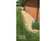 Close up of the home's exterior with brick and meticulous gravel landscaping at 4329 Dudley N Dr, Indianapolis, IN 46237