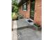 Inviting front entrance with brick facade, a blooming flower box, and manicured landscaping at 4329 Dudley N Dr, Indianapolis, IN 46237