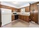 Functional kitchen with classic wood cabinets, a gas stove, and a traditional layout at 4329 Dudley N Dr, Indianapolis, IN 46237