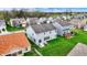 Aerial view of back exterior with a patio with outdoor furniture and a large lawn at 4546 Creighton Ln, Indianapolis, IN 46237