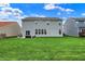 Large, well-maintained backyard with lush green grass, perfect for outdoor activities at 4546 Creighton Ln, Indianapolis, IN 46237