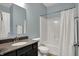 Full bathroom featuring a vanity with a granite countertop and a shower/tub with curtain at 4546 Creighton Ln, Indianapolis, IN 46237