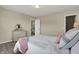 Relaxing bedroom with soft carpet, neutral paint, dresser, and ample lighting, creating a serene and restful space at 4546 Creighton Ln, Indianapolis, IN 46237