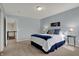 Comfortable bedroom with plush carpet, blue walls, and natural light creating a cozy and inviting atmosphere at 4546 Creighton Ln, Indianapolis, IN 46237