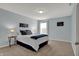 Cozy bedroom featuring ample light, comfortable carpet, and neutral decor, creating a tranquil retreat at 4546 Creighton Ln, Indianapolis, IN 46237