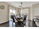 Elegant dining room with a modern chandelier and sliding glass doors to the patio at 4546 Creighton Ln, Indianapolis, IN 46237