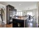Spacious kitchen featuring a center island, stainless steel appliances, and hardwood flooring at 4546 Creighton Ln, Indianapolis, IN 46237