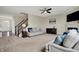 Large living room has two couches, fireplace, and staircase at 4546 Creighton Ln, Indianapolis, IN 46237