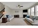 Spacious living room features a fireplace, large windows, and two comfortable couches at 4546 Creighton Ln, Indianapolis, IN 46237