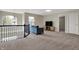 Upstairs loft area features a comfortable seating area and large windows at 4546 Creighton Ln, Indianapolis, IN 46237