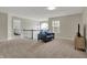 Spacious loft area with comfortable seating, large windows, and plenty of natural light at 4546 Creighton Ln, Indianapolis, IN 46237