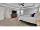 Large main bedroom features a ceiling fan, large dresser, and ensuite bath at 4546 Creighton Ln, Indianapolis, IN 46237
