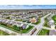 Aerial view of a neighborhood, featuring tree-lined streets and well-maintained homes with green lawns at 4546 Creighton Ln, Indianapolis, IN 46237
