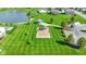 Overhead view of the community area with playground, gazebo, and pond at 4638 W Otway Ln, New Palestine, IN 46163