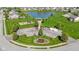 Aerial shot showcasing community amenities: playground, gazebo, and scenic pond at 4638 W Otway Ln, New Palestine, IN 46163