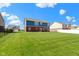 Picture of a spacious backyard, with lush green grass and a house in the background at 4638 W Otway Ln, New Palestine, IN 46163