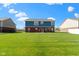 Expansive backyard featuring lush green grass and a patio, perfect for outdoor enjoyment at 4638 W Otway Ln, New Palestine, IN 46163