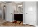 Bathroom with modern vanity, lighting and wood-look flooring at 4638 W Otway Ln, New Palestine, IN 46163