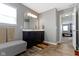 Bathroom with a modern vanity and an open doorway leading to the bedroom at 4638 W Otway Ln, New Palestine, IN 46163