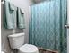 Bathroom with neutral walls and a shower with patterned curtain at 4638 W Otway Ln, New Palestine, IN 46163
