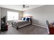 Bedroom with carpeted floors, natural light from window, and gray walls at 4638 W Otway Ln, New Palestine, IN 46163