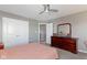 This bedroom has carpeted floors, closet space, and dresser with a mirror at 4638 W Otway Ln, New Palestine, IN 46163