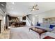 Open-concept living area with hardwood floors, fireplace, and a staircase leading to the upper level at 4638 W Otway Ln, New Palestine, IN 46163