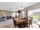 Open-concept living area with hardwood floors, fireplace, and direct access to an outdoor patio at 4638 W Otway Ln, New Palestine, IN 46163
