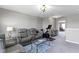 Cozy living room featuring a comfortable leather sofa and an exercise bike at 4638 W Otway Ln, New Palestine, IN 46163