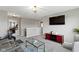 Upstairs living room with large TV and comfortable seating area at 4638 W Otway Ln, New Palestine, IN 46163