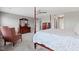 Bedroom featuring a ceiling fan, sitting chair, and ensuite bathroom at 4638 W Otway Ln, New Palestine, IN 46163