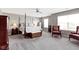 Spacious main bedroom with ceiling fan and large windows allowing ample natural light at 4638 W Otway Ln, New Palestine, IN 46163