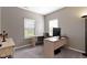 Neutral-toned office with natural light, built-in desk, and comfortable workspace at 4638 W Otway Ln, New Palestine, IN 46163