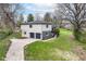 Aerial view of two-story home with a two-car garage, a concrete driveway and green lawn at 5302 E 46Th St, Indianapolis, IN 46226
